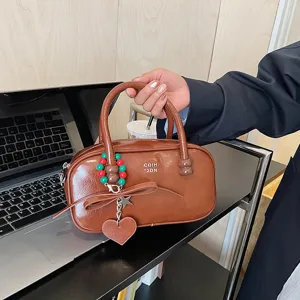 Vintage braune Lackleder Bowling Tasche mit süßer Schleife für Damen stilvolle Handtasche.
