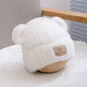 Cute white plush bear ear hat for kids, warm winter knitted cap with cute animal ears design.