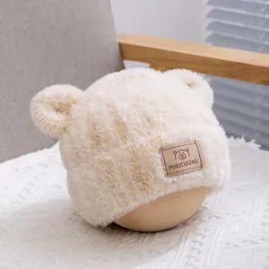 Cute plush bear ear hat for kids, autumn and winter warm cozy windproof fuzzy cap in beige.