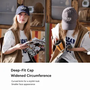 Cotton baseball cap with curved brim, deep crown and embroidered letter design for sun protection.