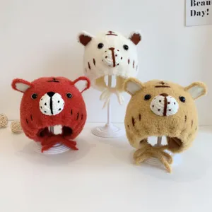 Cute tiger plush winter beanie detail view, warm knitted earflap baby hat display.