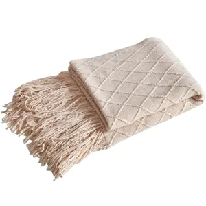 Beige knitted throw blanket with diamond pattern and tassels for sofa bed homestay decor