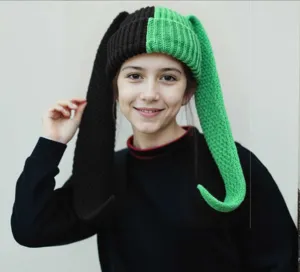 Detail shot of color-block knit rabbit ear hat, warm and cute winter beanie for daily wear.