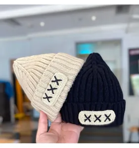 Detailed view of baby winter knit beanie hat, warm ribbed pullover cap for toddlers boys and girls.