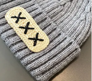 Grey knit baby beanie winter warm infant cap with embroidered patch detail stylish cozy headwear