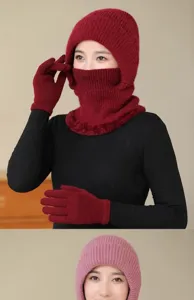 Detailed view of women winter knitted integrated hat scarf mask and gloves set in red.