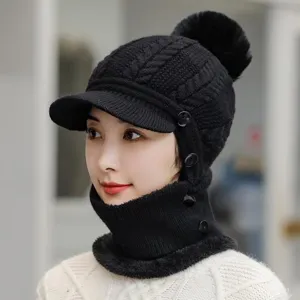 Black knitted visor beanie with fleece lining detail showing warm winter hat design