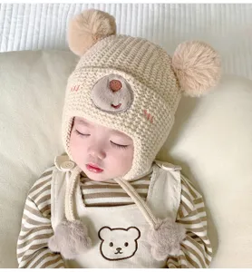 Cute baby knitted bear hat with pom poms detail, winter warm earflap cap for infants