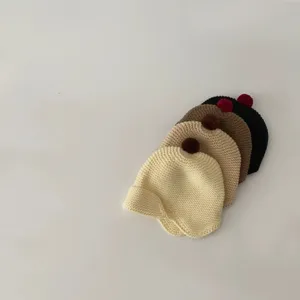 Cute toddler knit ear-protection hat with pom-pom detail, warm solid color winter baby beanie.