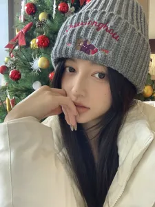 Cute knitted beanie for women with adorable bear embroidery, warm and stylish winter hat.