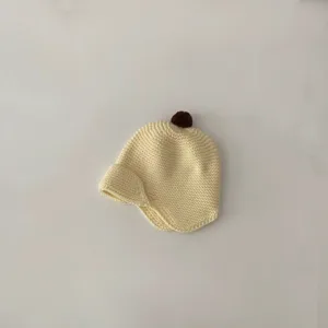 Adorable baby knit hat with cute pom pom and earflaps, warm winter beanie for toddlers.