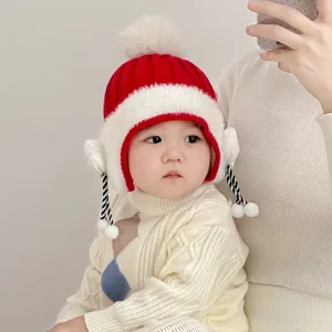 Cute baby winter knit hat with ear flaps and pom-pom, warm and cozy toddler beanie cap.