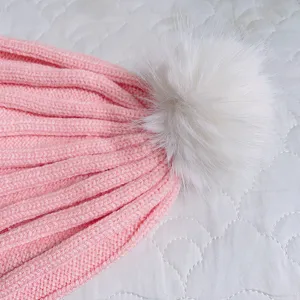 Pink baby winter knit hat with white fluffy pom pom, warm and soft infant beanie for cold days.