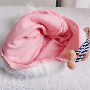 Cute baby winter knitted hat with plush lining and fluffy pom-pom warm cozy toddler cap.
