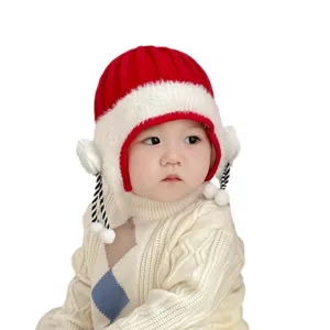 Cute baby winter knitted hat with earflaps, warm red and white design for toddlers.