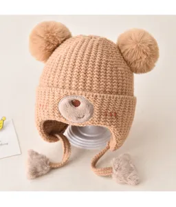 Cute baby knit hat with double pom-poms and bear ears, warm winter earflap cap for kids.