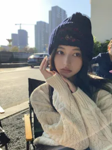 Cozy dark blue knit beanie with cute bear embroidery, perfect warm winter hat for women.