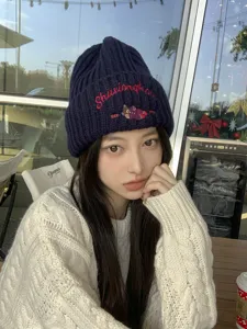 Cozy knit beanie hat for women featuring cute bear embroidery and winter warm design detail.