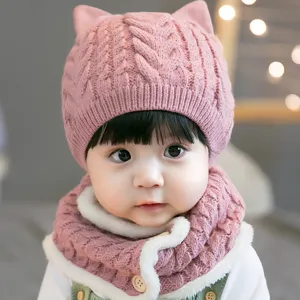 Cute pink knitted baby cat ear hat and fleece lined scarf set, warm winter outfit for toddlers.