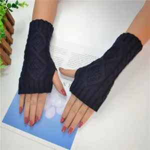 Dark blue knitted arm warmers detail, short winter elastic ribbed fingerless gloves style.