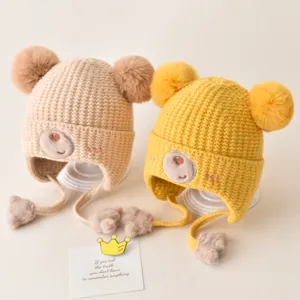 Cute baby winter knit hat with double pom poms and cute bear embroidery, warm earflap design.