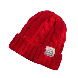 Classic red winter knitted beanie hat for women and men, warm thick cable knit cap for cold weather.