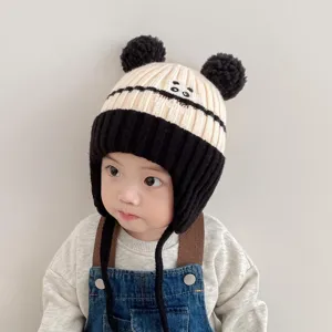 Cute baby winter warm knitted ear-flap hat with double pom-poms, soft infant wool cap.
