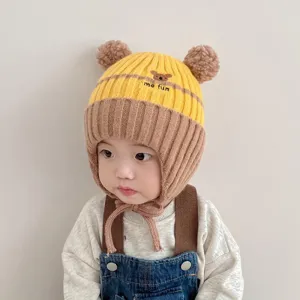 Cute baby winter warm knit earflap hat with cute bear ears and embroidery detail for cold days.