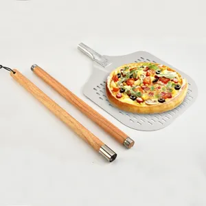Large aluminum alloy perforated pizza peel with detachable wooden handle for home baking use.