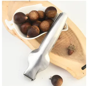 Stainless steel chestnut opener tool detail shot, durable metal clip for peeling nuts easily.