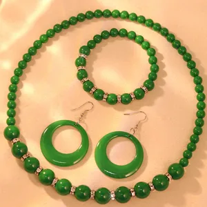 Green acrylic beaded necklace bracelet earrings set detail view for women fashion styling.