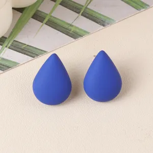Blue teardrop acrylic stud earrings detail, minimalist cute ear jewelry for daily wear.
