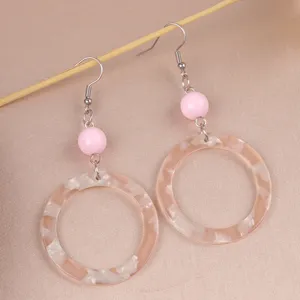 Retro acrylic hoop dangle earrings with pink beads, stylish geometric resin jewelry for women detail view.