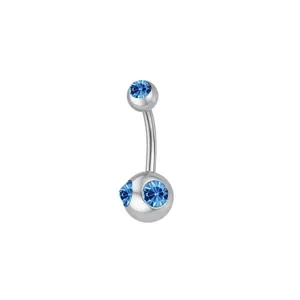 Close-up detail of stainless steel belly button ring featuring sparkling blue crystal stones.