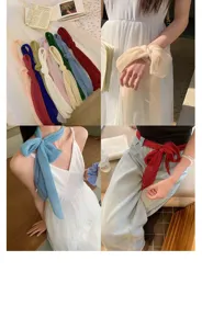 Detailed view of multi-color pleated silk-feel ribbon scarf styled on wrist, neck and waist.