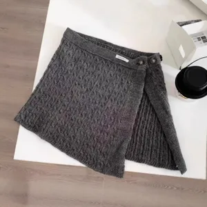 Dark grey cable knit mini wrap skirt with buttons, stylish layered winter skirt for women.