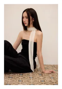 Elegant white pleated long scarf detail, lightweight ribbon neck accessory for chic spring looks.