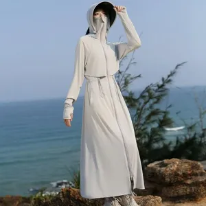 Detail view of women's long sun protection jacket, outdoor UV-blocking coat with mask.