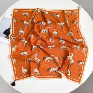 Luxury orange horse print square scarf with tassel trim, elegant old money style neck wrap.