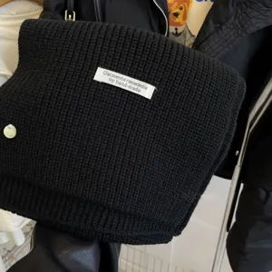 Winter black knitted scarf for women, cozy thick wool short neck warmer for cold weather.