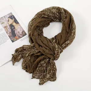 Brown pleated floral voile scarf detail shot, lightweight spring neck wrap accessory.