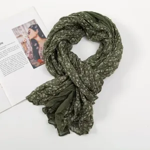 Dark green floral crinkled scarf, lightweight sheer fabric, elegant everyday women's wrap accessory.