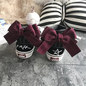 Cute black canvas shoes with large bowknot, trendy casual footwear for women and teen girls.