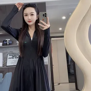 Women's long black sun protection dress with front zipper and pleated hem for outdoor summer.