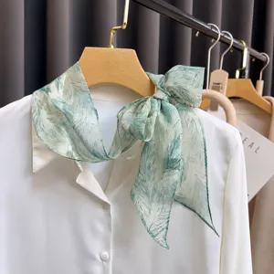 Elegant green feather print silk scarf, chic neck bow tie for women, premium fabric style.