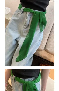 Green pleated long silk scarf ribbon accessory styled as a chic waist belt for women.