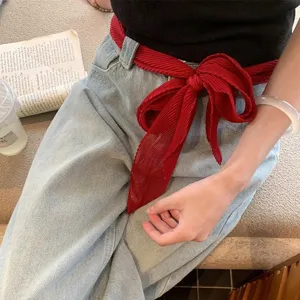 Solid color pleated faux silk long scarf ribbon styled as a chic waist belt for women.