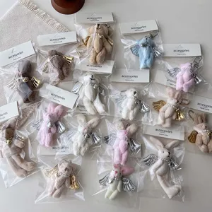 Plush angel bear rabbit keychain pendant with wings and pearls, cute bag phone charm accessory.