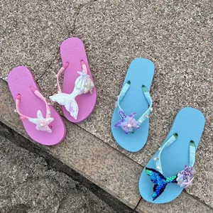 Women summer flip flops with sparkling sequin mermaid tail, shell and pearl beach sandals.