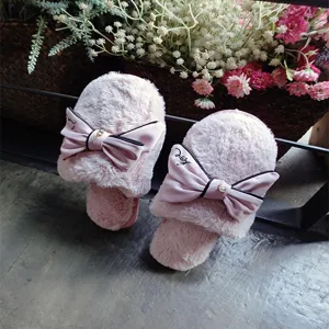 Cute plush winter slippers for women with handmade satin bow, soft warm indoor house shoes.